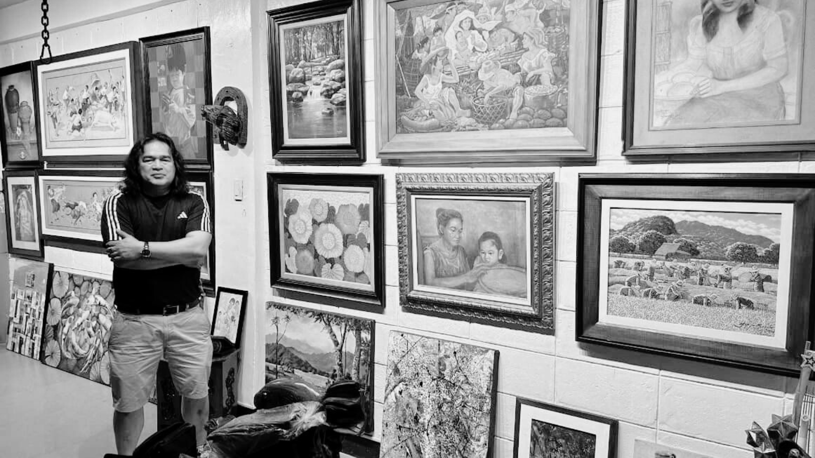 Framed Filipino paintings on the wall at Batalla Gallery